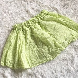 Green floral mini skirt with white flowers